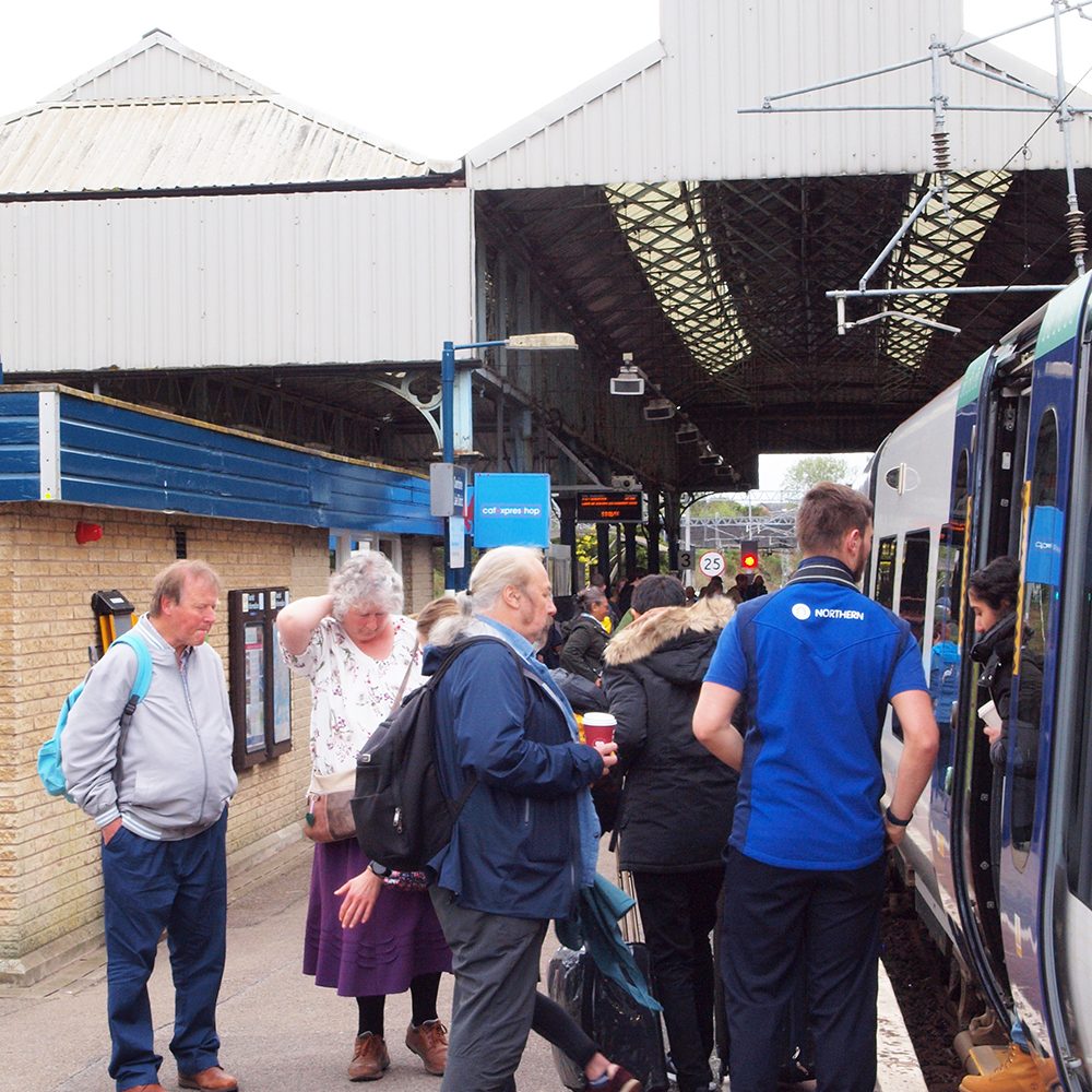 Passengers and staff at Oxenholme station